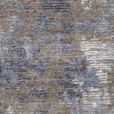 Close-up of textured fabric or carpet with abstract mottled pattern.