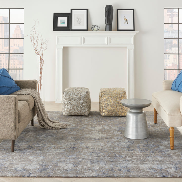 Contemporary living room with neutral palette, mid-century furniture, and urban view.