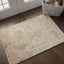Vintage-style area rug placed near French doors in well-lit room