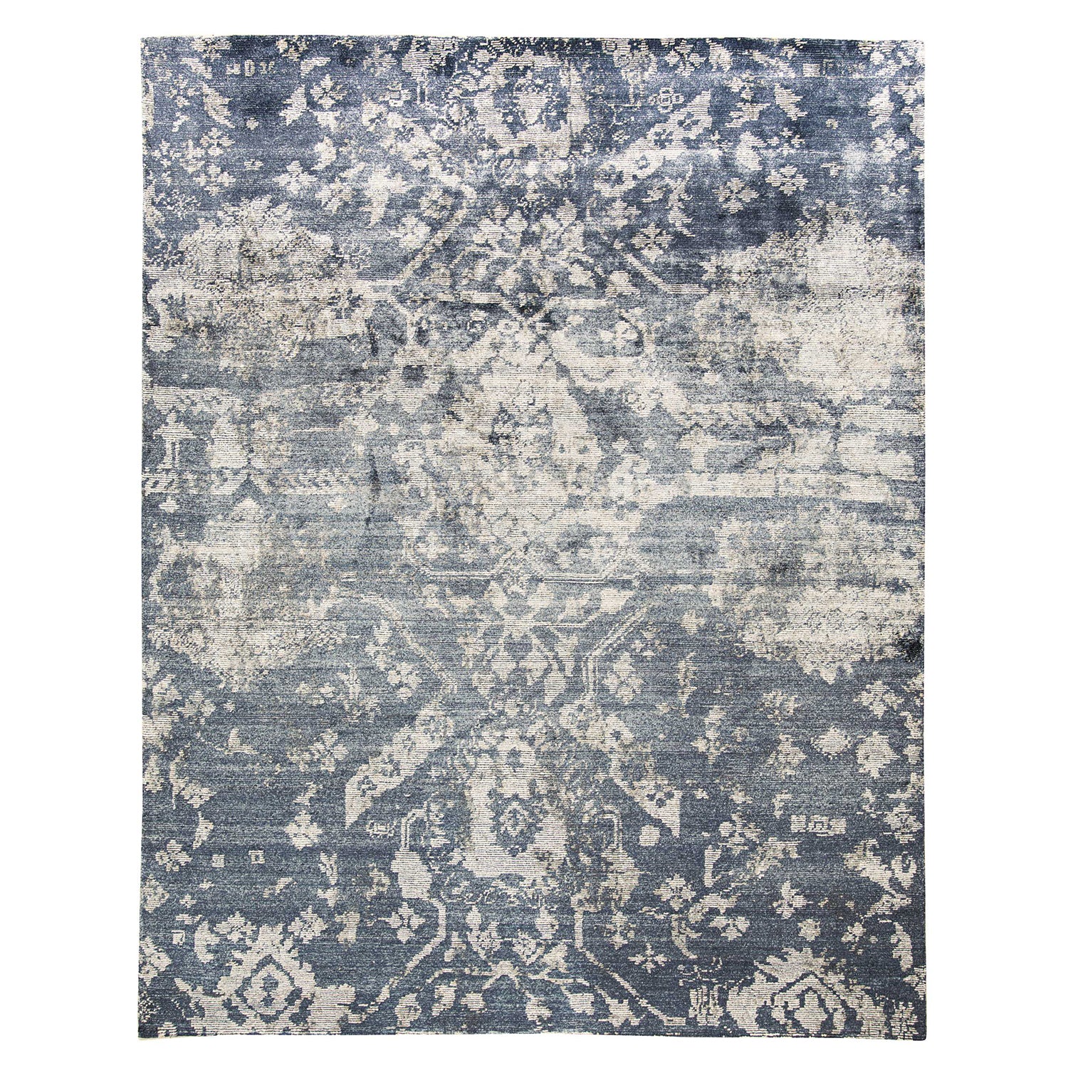 Vintage-style area rug with distressed blue and gray floral design.