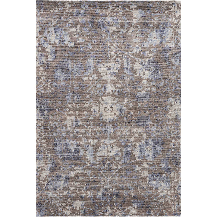 Vintage-inspired rectangular area rug with intricate floral motifs in muted tones.