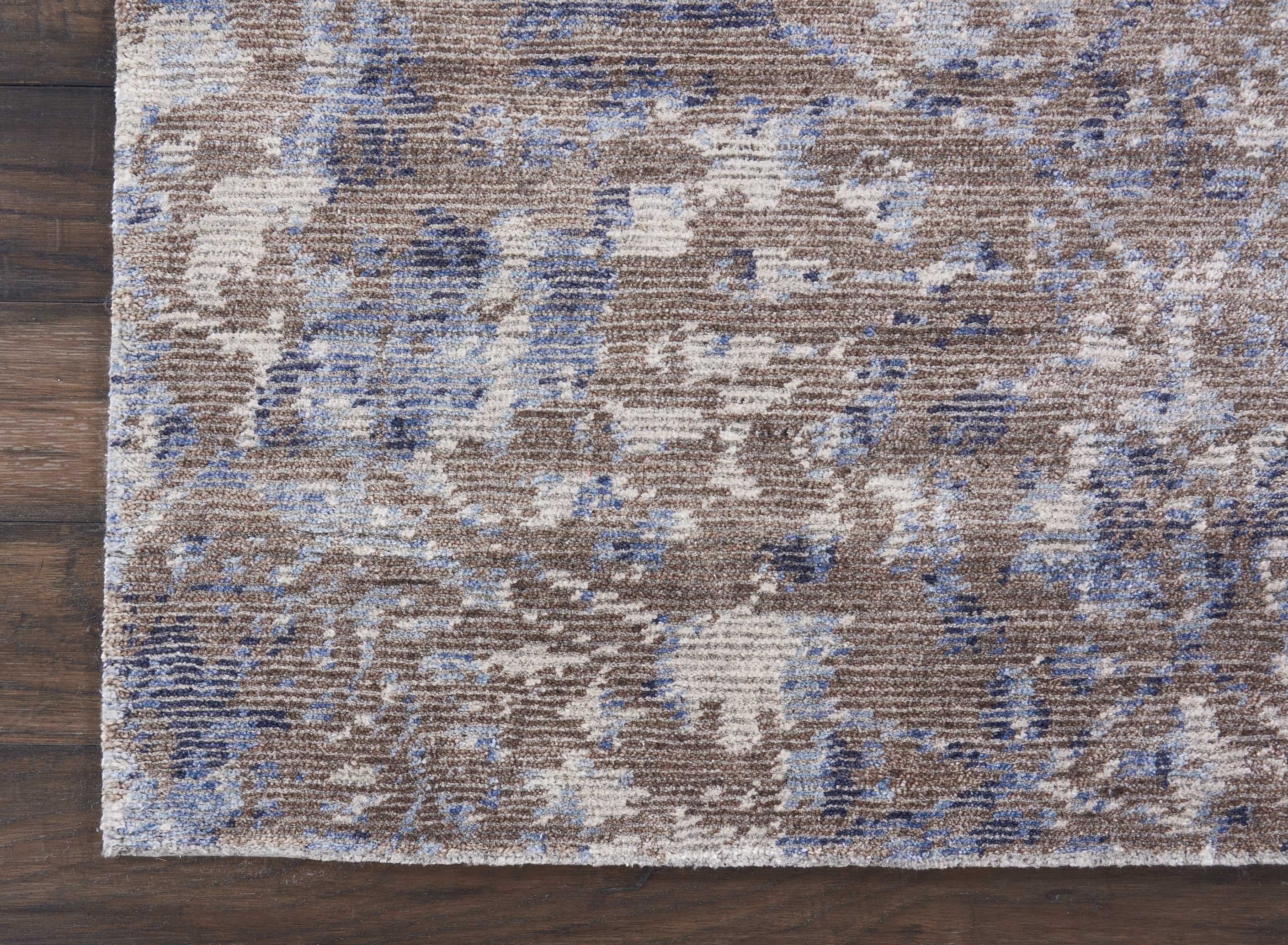 Abstractly patterned rug blends vintage and modern aesthetics seamlessly.