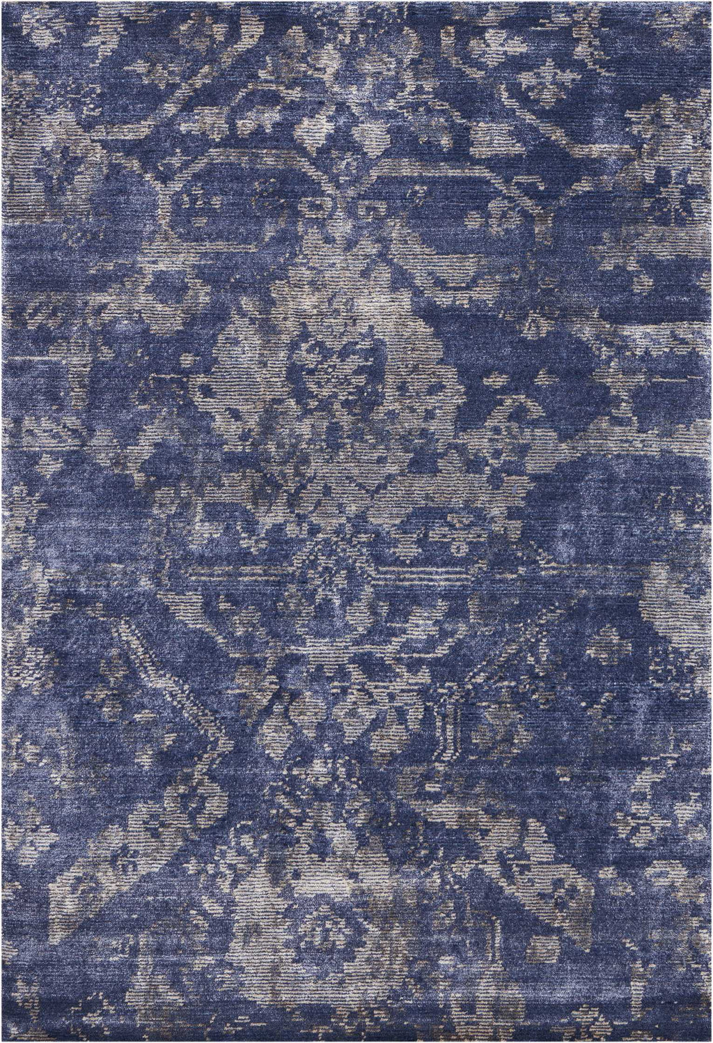 Distressed vintage rug with traditional motifs in shades of blue.