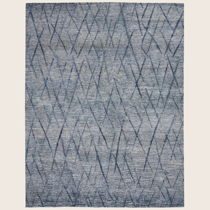 Abstract blue gradient rug with diagonal crisscrossing lines, modern design.