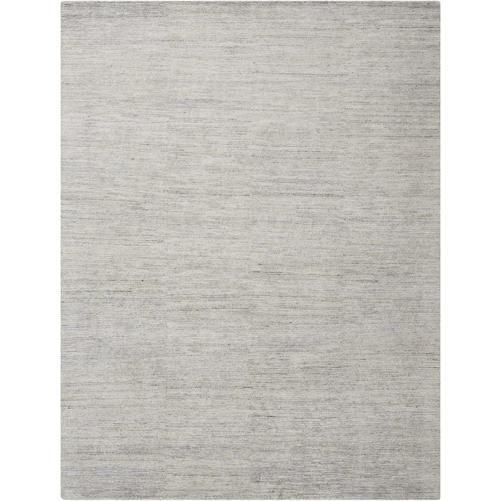 Minimalistic rectangular area rug in shades of light grey/silver.