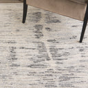 Close-up of modern furniture on distressed patterned rug with texture