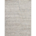 Abstract and modern textured area rug in neutral tones.