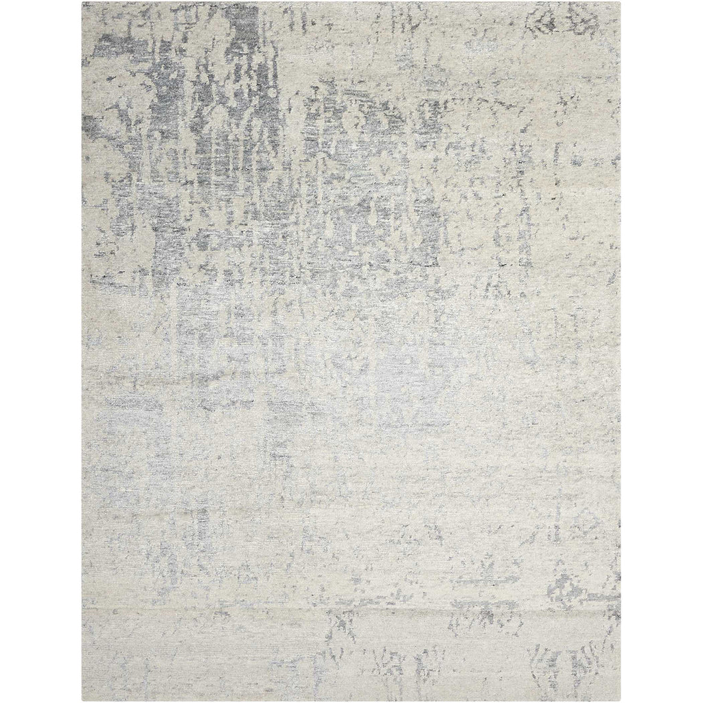 Abstract rug with distressed look and muted color palette.