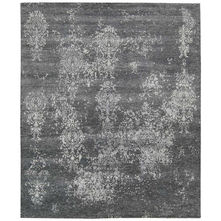 Rectangular area rug with distressed vintage design in elegant motif.