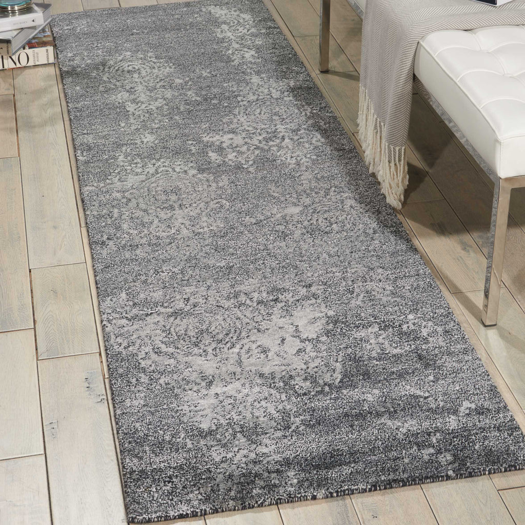 Vintage-style rectangular area rug with distressed look and neutral palette.