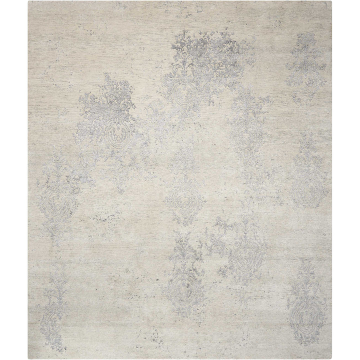 Elegant, versatile rug with subtle damask-like design in muted tones.