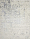 Abstract gray and white pattern, resembling a modern textured rug.