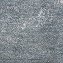 Close-up of speckled, looped weave fabric with monochromatic texture.