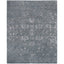 Faded gray rectangular rug with intricate vintage-inspired distressed pattern.