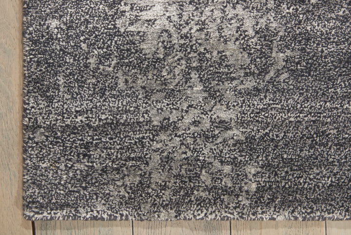 Close-up of a speckled rug with a plush, mottled design.