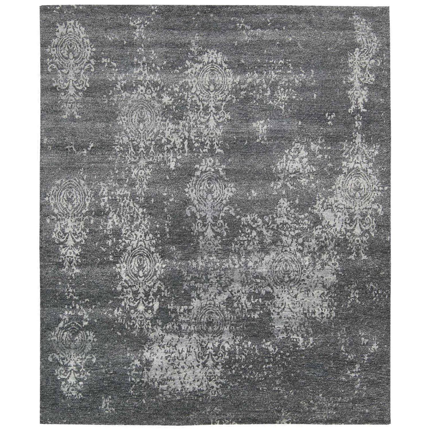 Monochromatic gray rug with distressed vintage floral motifs and gradient background.