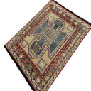 Intricately designed oriental rug featuring geometric and floral patterns.