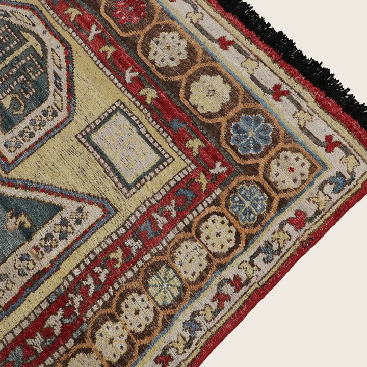 Ornately patterned rug showcasing complex geometric and floral motifs.