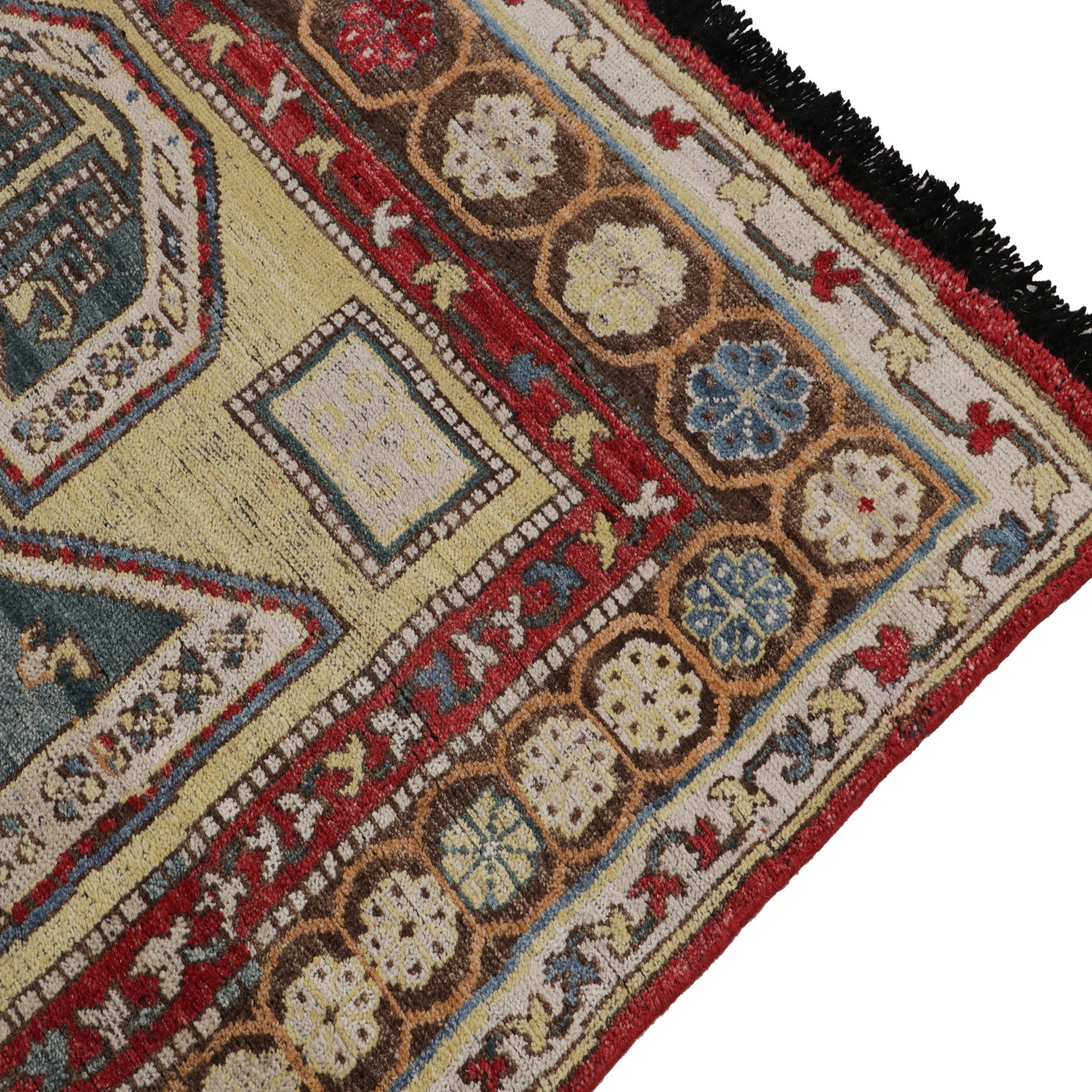 Ornately patterned rug showcasing complex geometric and floral motifs.