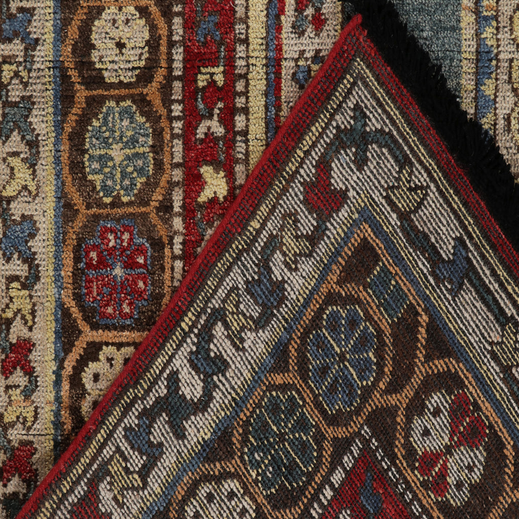 Close-up of two intricate, handwoven carpets with rich colors and patterns.
