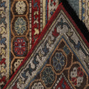 Close-up of two intricate, handwoven carpets with rich colors and patterns.