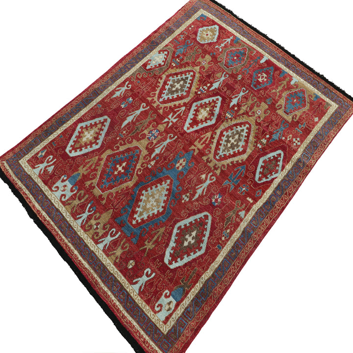 Exquisite oriental rug with intricate patterns in rich red tone.