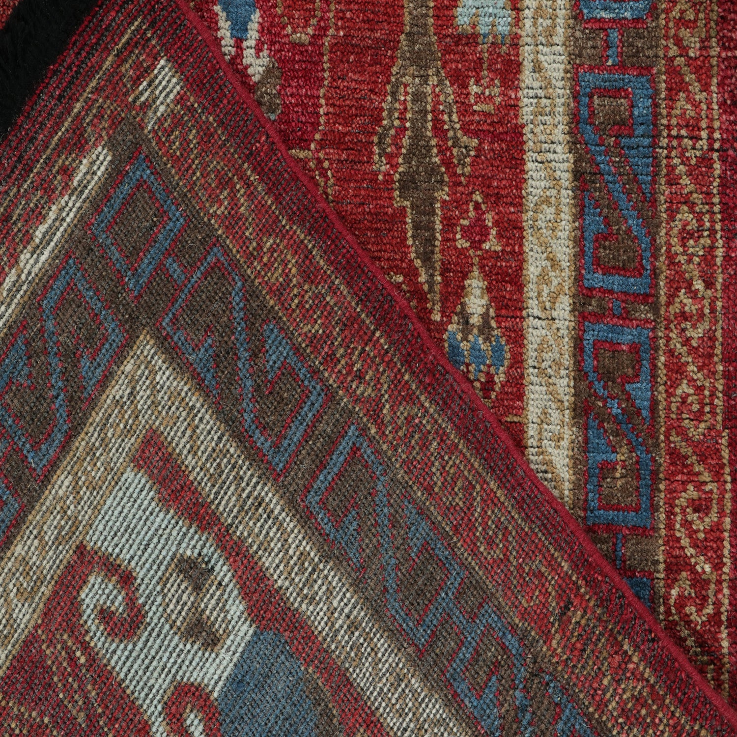 Close-up view of traditional handwoven carpets showcasing intricate patterns.