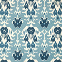 Symmetrical, ikat-style fabric pattern in shades of blue and off-white.