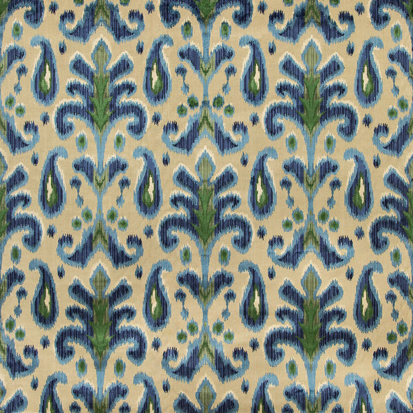 An intricately patterned fabric with symmetrical floral motifs in blue and green on a neutral background.