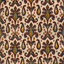 Close-up of intricate, symmetrical botanical fabric pattern with blue and green motifs.