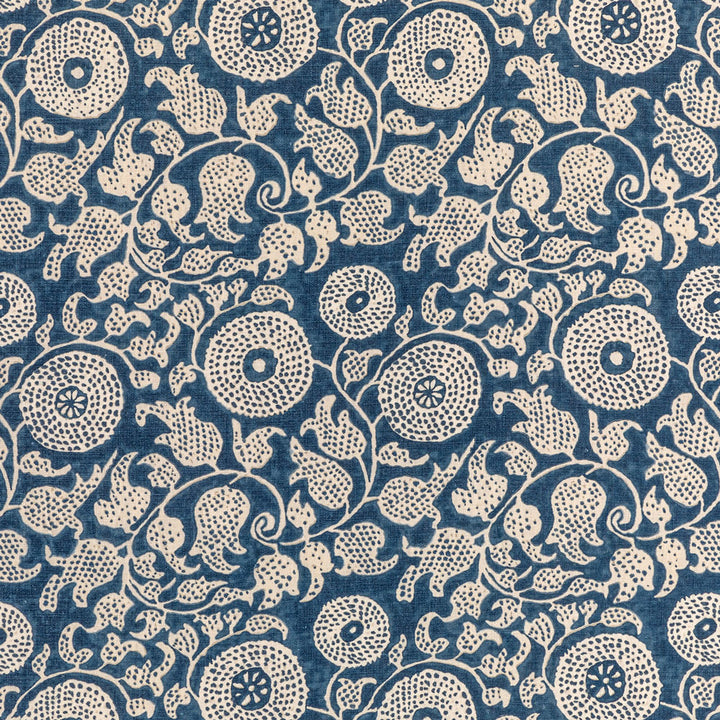 Traditional indigo resist-dyed fabric with intricate paisley and floral motifs.