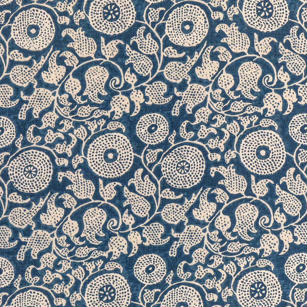 Traditional indigo resist-dyed fabric with intricate paisley and floral motifs.
