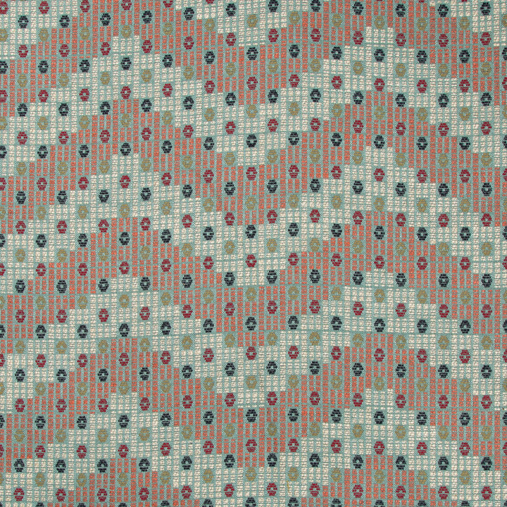 Patterned fabric with intricate motifs in red, black, turquoise, and white.