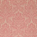 Floral damask fabric with intricate pink motifs on beige background.
