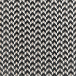 Monochromatic chevron pattern offers visually engaging and dynamic surface design.