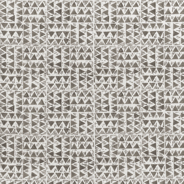 Seamless tribal-inspired pattern with geometric shapes in monochrome colors.