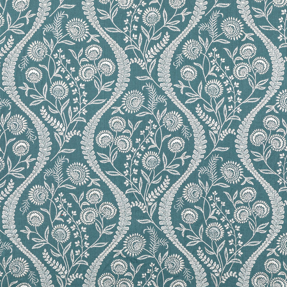 Teal background with a floral motif pattern in cream shade.