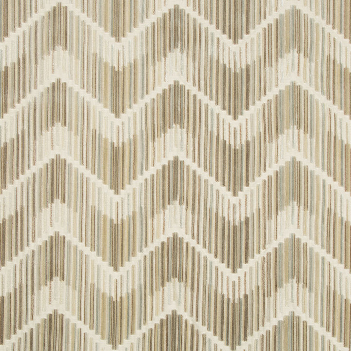 Patterned fabric with a zigzag design in creams and grays.