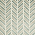 Textile showcasing herringbone pattern in cream and teal colors.