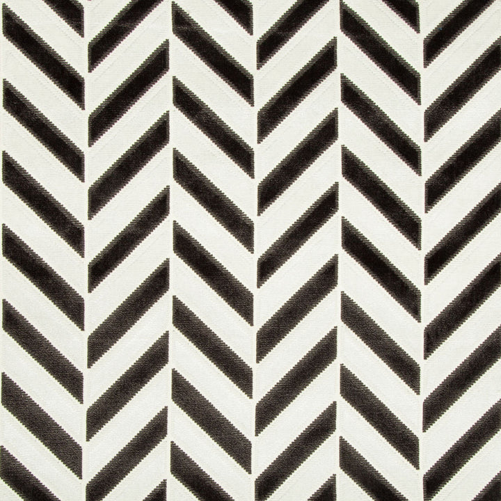 Bold, high-contrast black and white zigzag pattern on textured fabric.