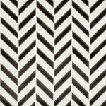Bold, high-contrast black and white zigzag pattern on textured fabric.