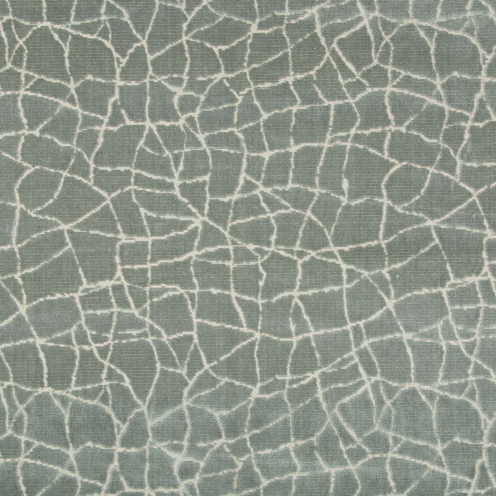 Abstract green fabric with cracked glass pattern and white lines.