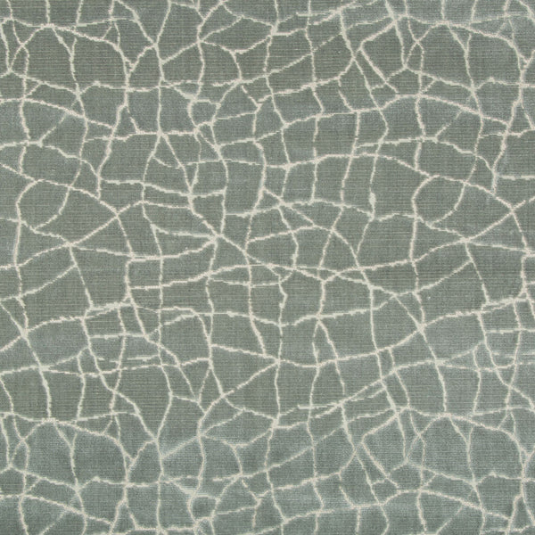 Abstract green fabric with cracked glass pattern and white lines.