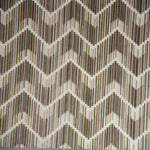 Geometric patterned fabric in neutral tones, adding style to interiors.