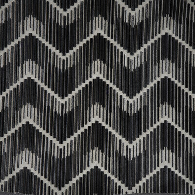 Monochromatic chevron textile brings bold and dynamic pattern to décor.