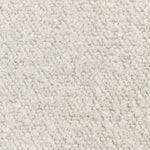 Close-up of a soft, fluffy, and mottled white carpet texture.