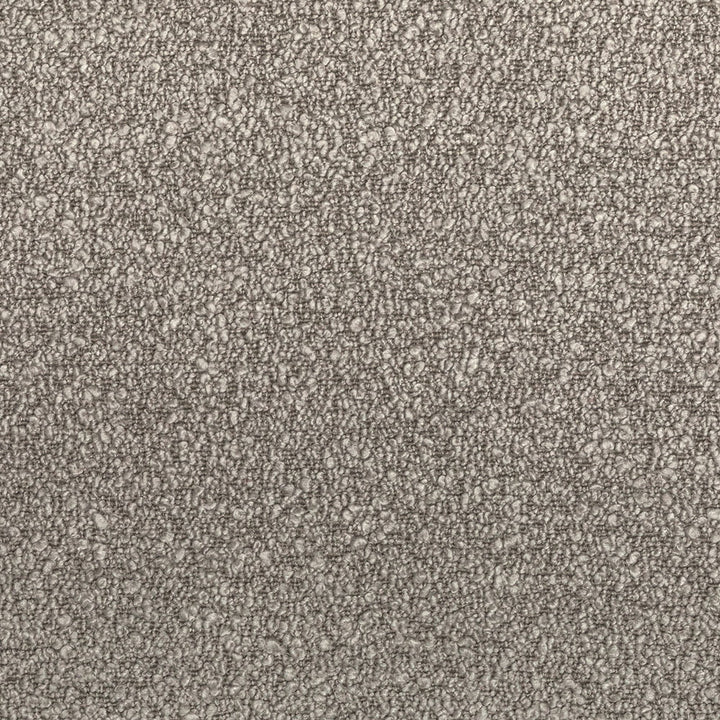 Close-up shot of a monochromatic, textured fabric with a uniform pattern.