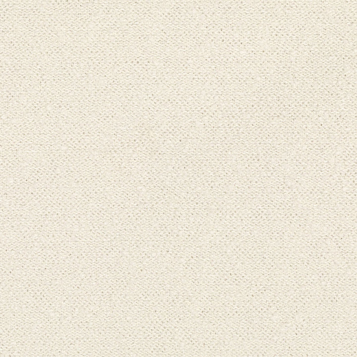 Close-up of cream fabric with dotted pattern, versatile for backgrounds.