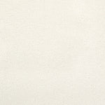 Close-up of a beige textured surface with a gritty effect.