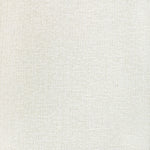 Close-up of off-white fabric with tight, looped pattern texture.